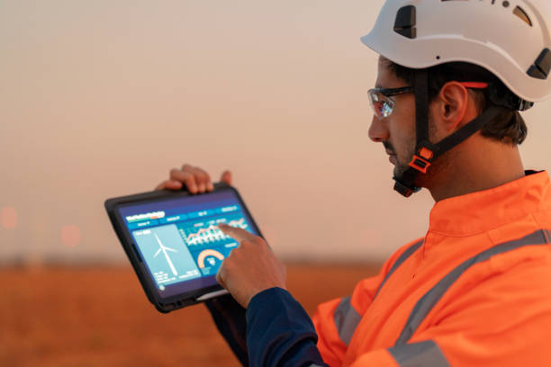 Field service technician using tablet app on site
